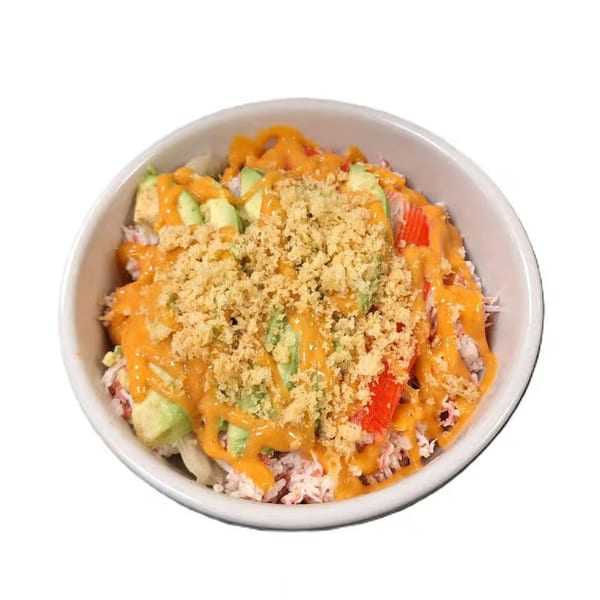 Hoshi Japanese Steakhouse's sushi bowl with avocado, crab, red peppers, orange sauce, and crispy toppings.