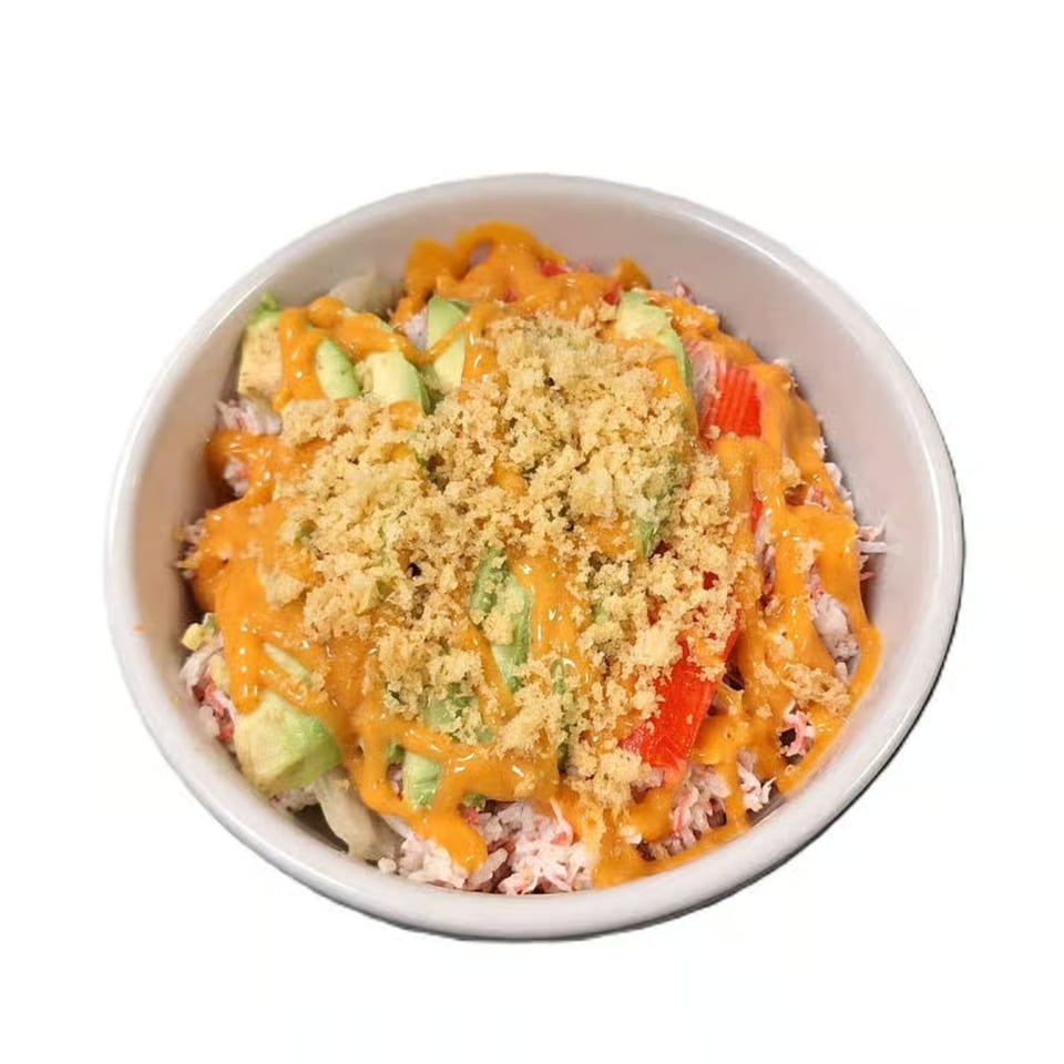 Hoshi Japanese Steakhouse's sushi bowl with avocado, crab, red peppers, orange sauce, and crispy toppings.
