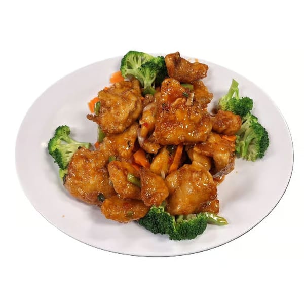 Hoshi Japanese Steakhouse's General Tso's chicken, with broccoli and carrots, on a white plate.