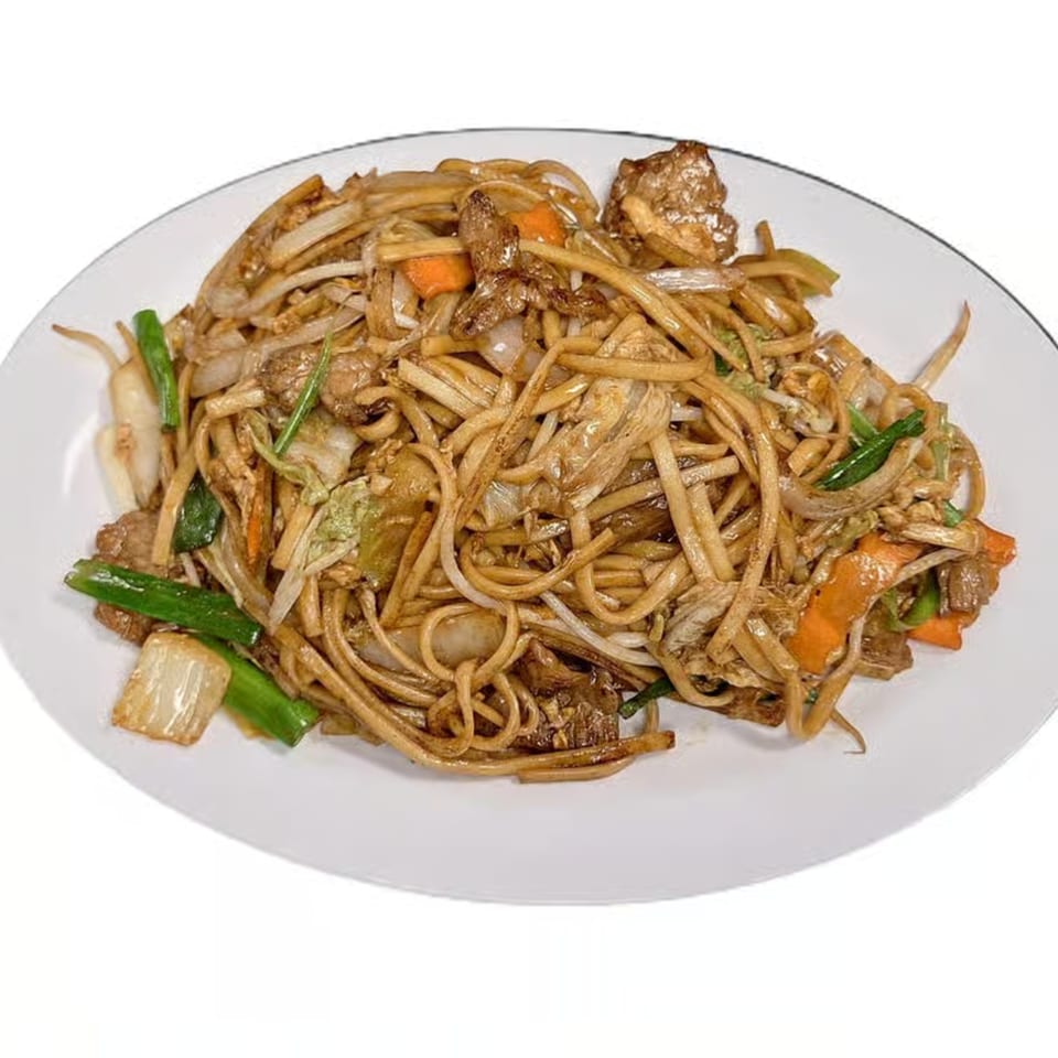 Hoshi Japanese Steakhouse's beef lo mein with noodles, carrots, cabbage, and green onions on a white plate.